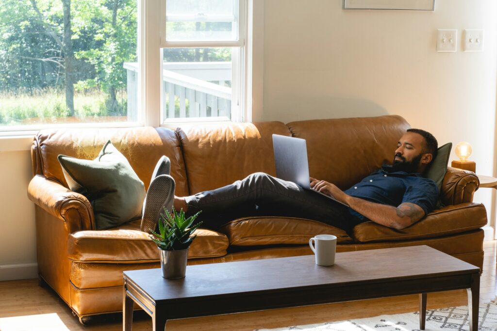 Man reviewing real estate market trends on his computer before a home appraisal