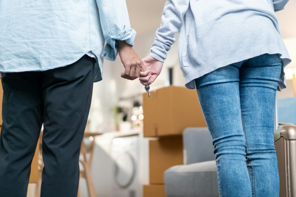Couple looking into their home after receiving a low home appraisal report
