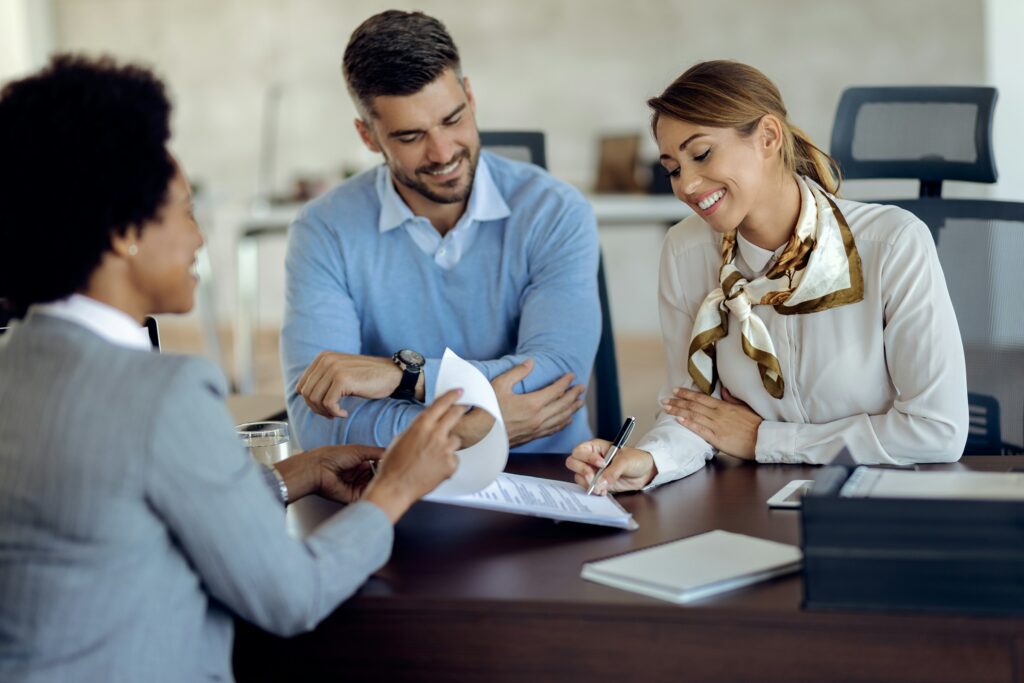 Realtor advising clients on home appraisal near top school districts