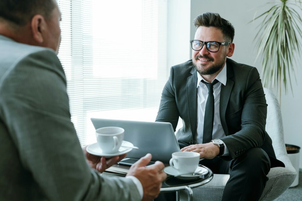 Homeowners meeting with an appraisal professional to discuss results from a second appraisal.
