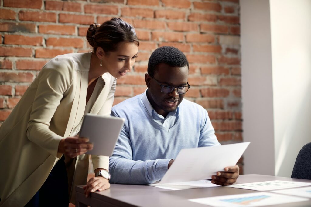 Professional appraiser guiding a client through the unique challenges of an estate appraisal involving diverse properties.