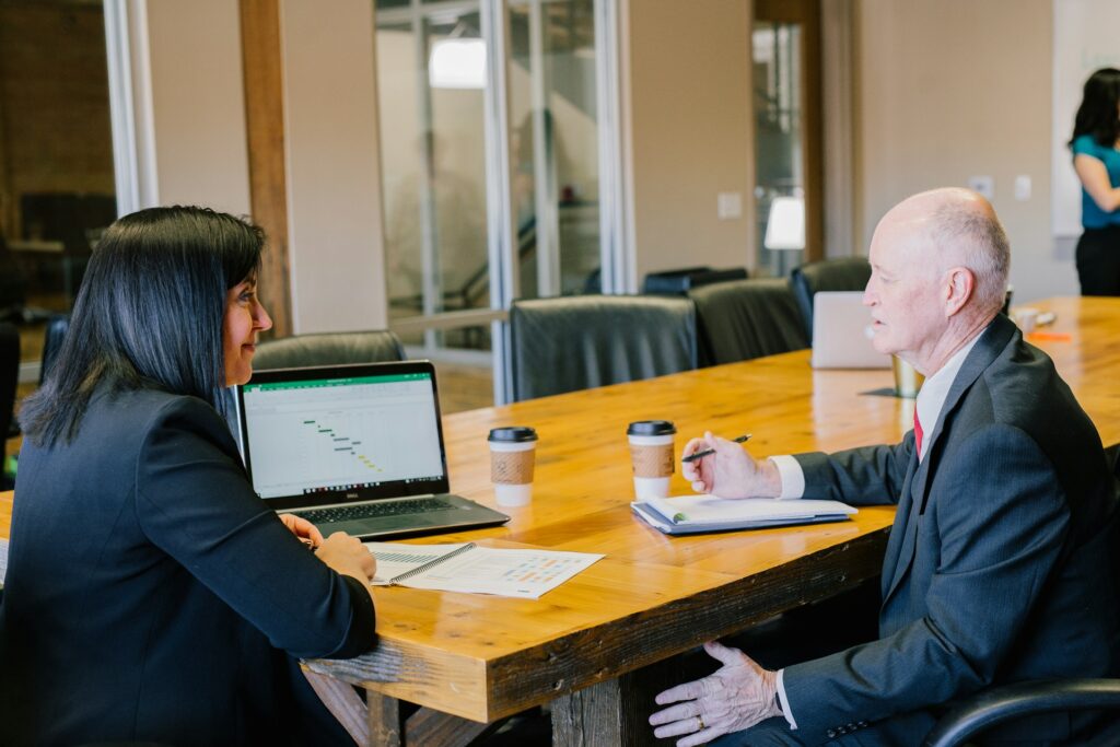Divorce appraisal specialist meeting with a client to review home value for an equitable settlement.
